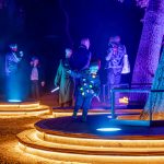 A young visitor enjoys the Symphony of Oaks at Enchanted Forest of Light © Kathryn Rapier