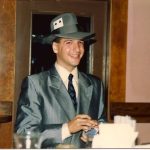 performing as a young magician is Tom Frank in a gray suit